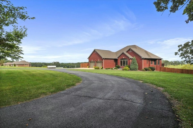 ranch-style home with a garage and a front lawn