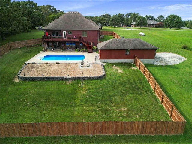 view of swimming pool with a lawn, a patio area, and a deck