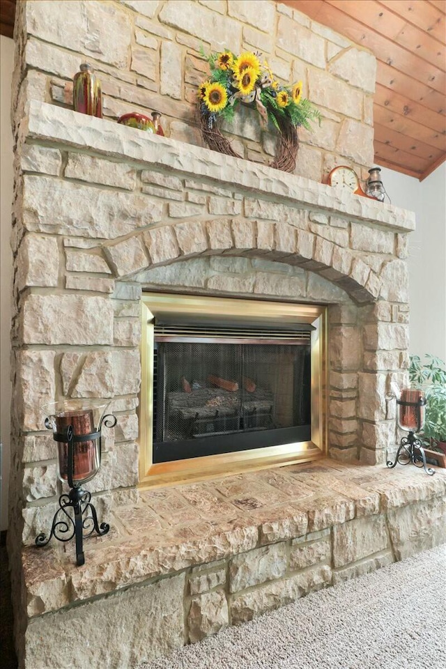 interior details with a stone fireplace