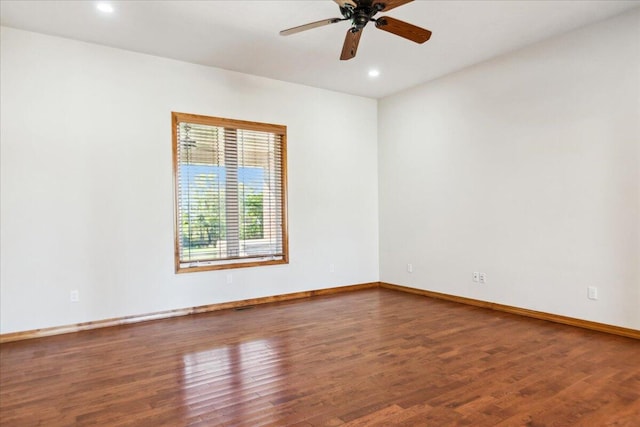 spare room featuring ceiling fan and hardwood / wood-style floors