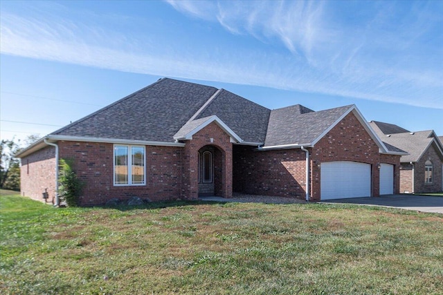 view of front of house with a garage and a front yard