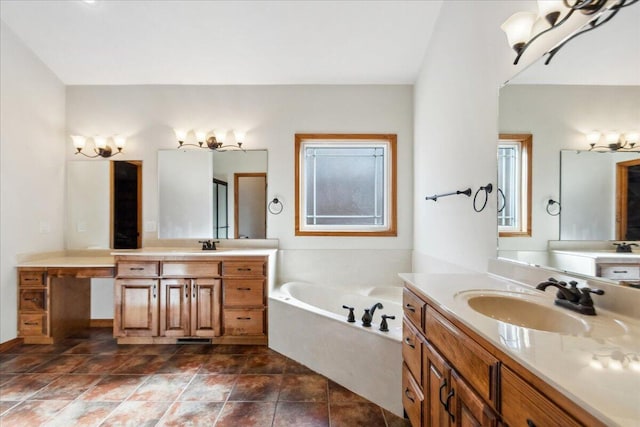 bathroom with tile patterned flooring, a bathing tub, and vanity