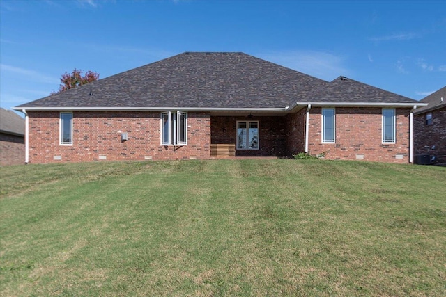 back of house with a yard