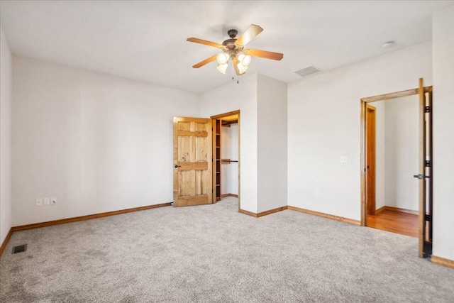 unfurnished bedroom with carpet flooring and ceiling fan