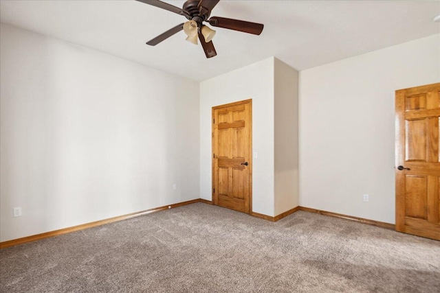 unfurnished bedroom featuring ceiling fan and carpet flooring