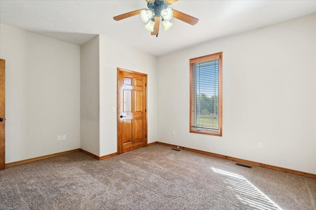 unfurnished bedroom featuring light colored carpet and ceiling fan