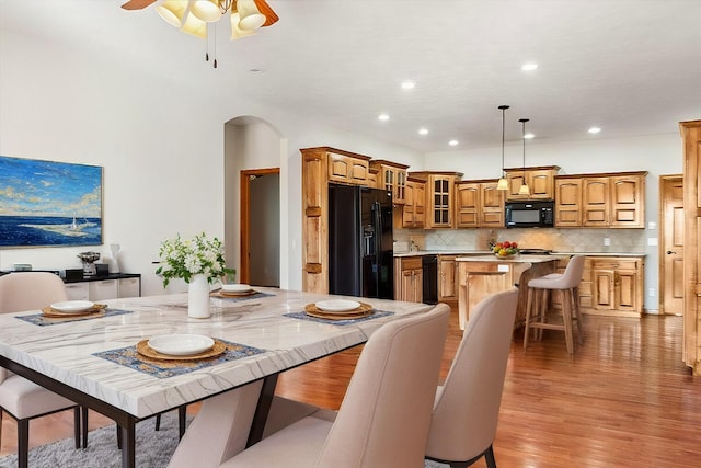 dining area featuring ceiling fan and light hardwood / wood-style flooring