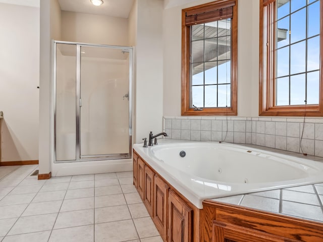 bathroom with tile patterned flooring and independent shower and bath