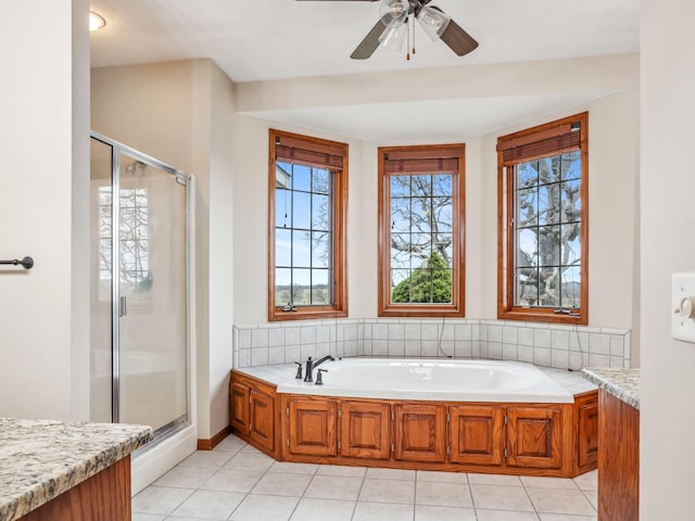 bathroom featuring tile patterned flooring, vanity, and plus walk in shower