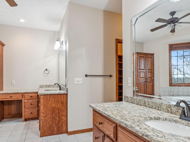 bathroom with ceiling fan, tile patterned flooring, vanity, and vaulted ceiling