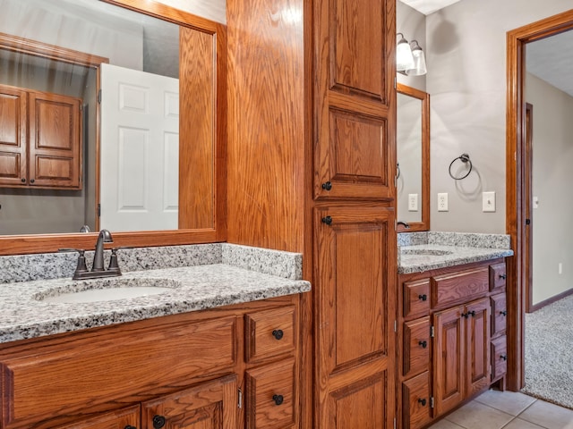 bathroom featuring tile patterned flooring and vanity