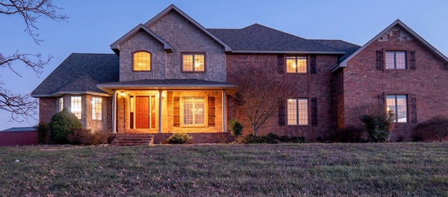 view of front of house with a lawn