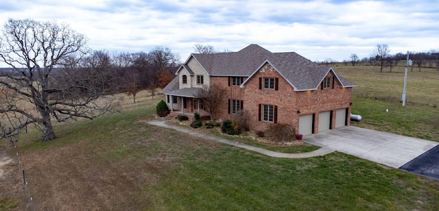 view of front facade with a garage and a front yard