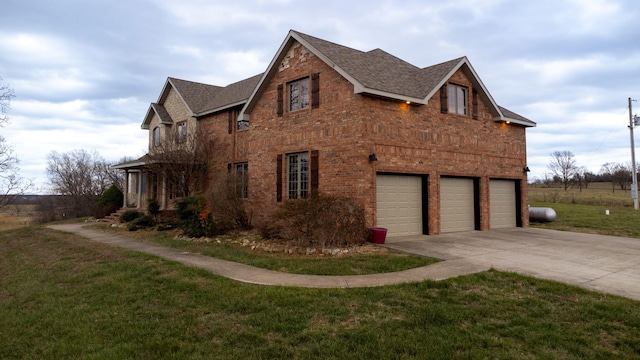 view of property exterior with a garage and a yard