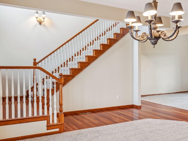 stairs with wood-type flooring