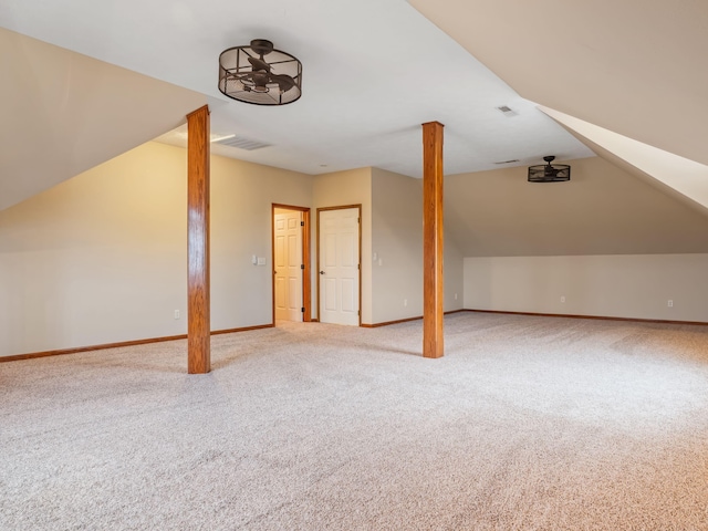 bonus room with carpet floors and lofted ceiling