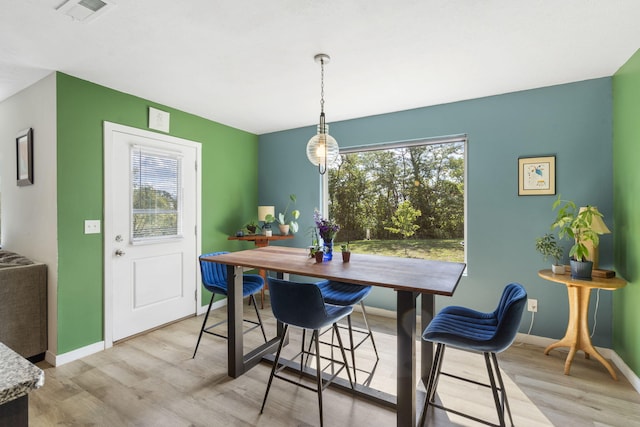 dining room with light wood-type flooring