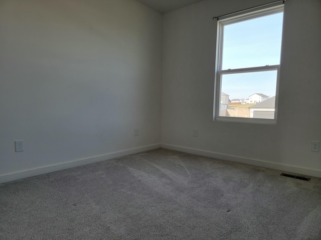 empty room with carpet flooring