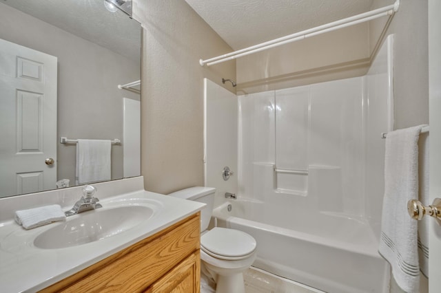 full bathroom featuring shower / tub combination, vanity, a textured ceiling, and toilet