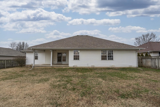 back of property featuring a lawn and a patio area