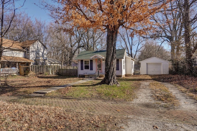 view of front of property featuring an outbuilding and a garage