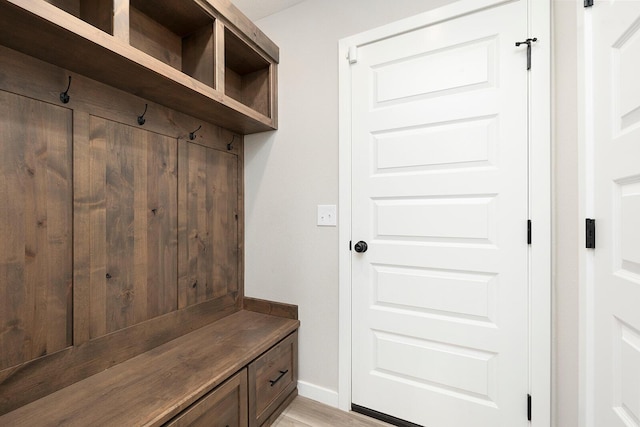 mudroom with light hardwood / wood-style floors