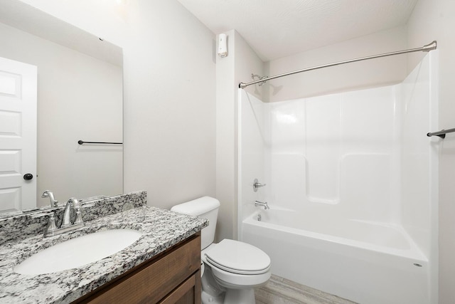 full bathroom featuring shower / bathing tub combination, vanity, toilet, a textured ceiling, and wood-type flooring