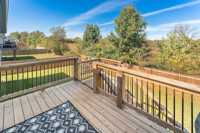 wooden terrace with a lawn