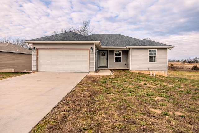 ranch-style house with a garage and a front yard