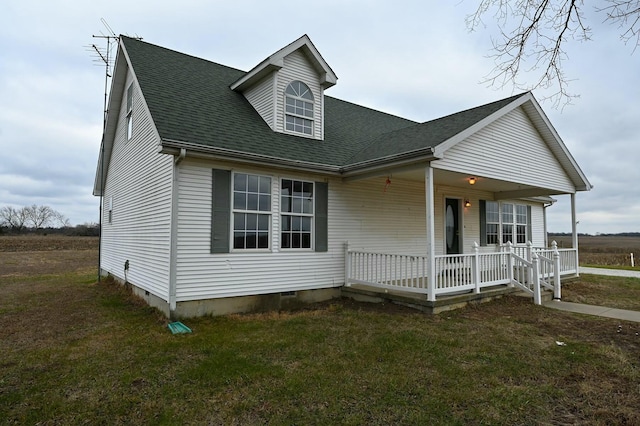 view of front of home featuring a front yard and a porch