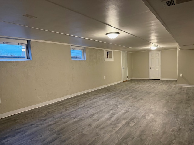 basement featuring hardwood / wood-style flooring