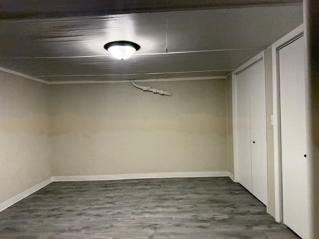 basement with hardwood / wood-style floors