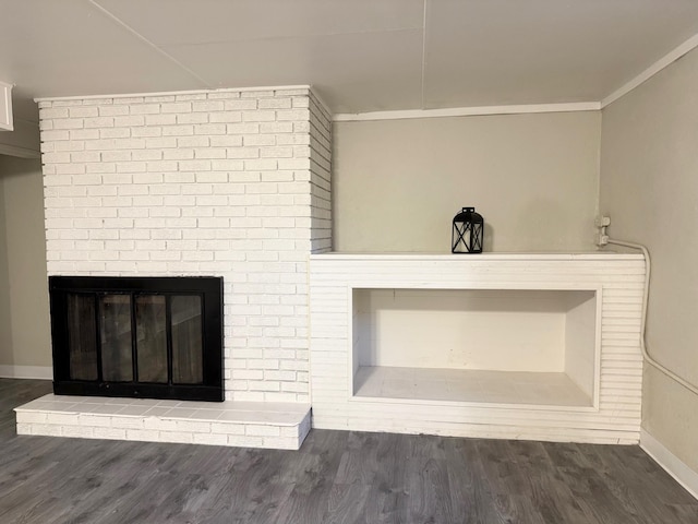 details featuring a fireplace, wood-type flooring, and ornamental molding