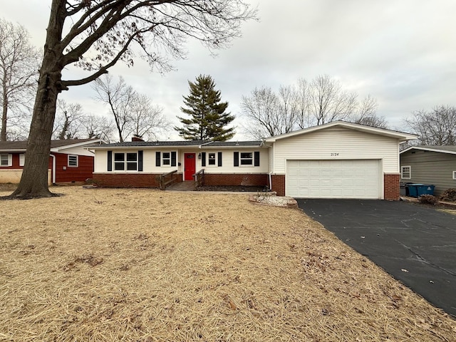 ranch-style home featuring a garage