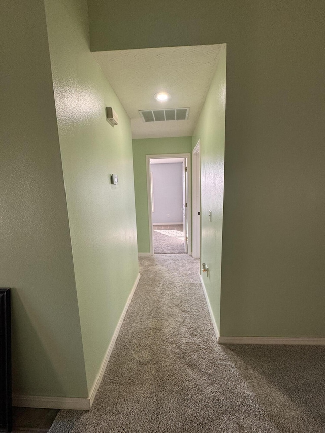 hall with carpet floors