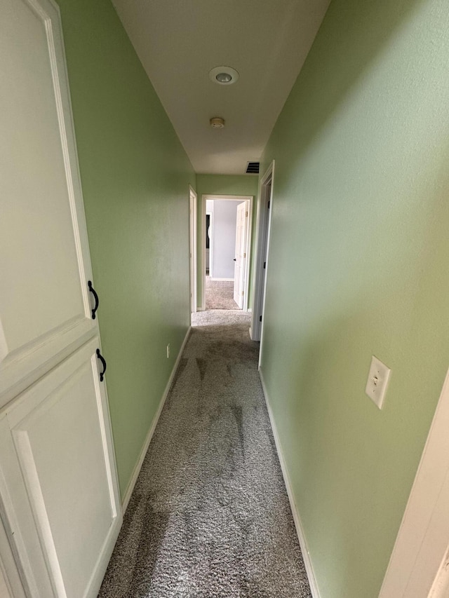 hallway featuring carpet flooring