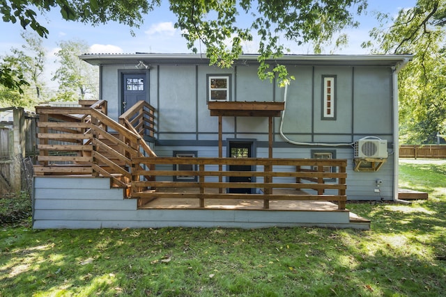 back of house with a yard and a deck