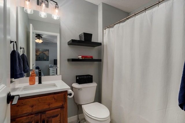 bathroom with ceiling fan, vanity, and toilet