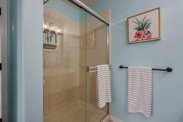 bathroom featuring an enclosed shower