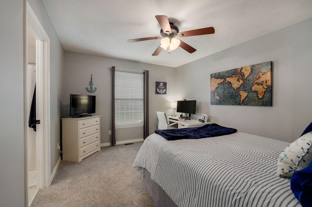 bedroom featuring light carpet and ceiling fan