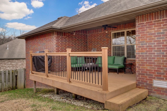 wooden deck with an outdoor living space