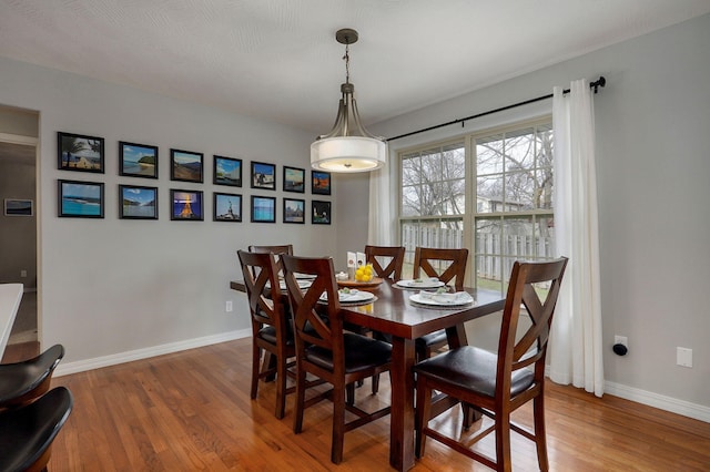 dining space featuring hardwood / wood-style flooring