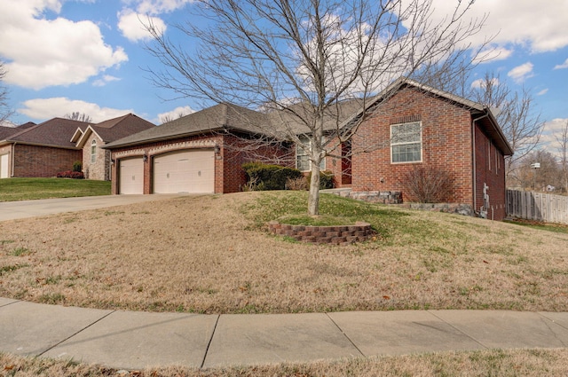 ranch-style house with a garage and a front yard