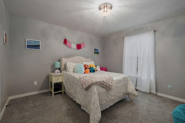 carpeted bedroom with a textured ceiling