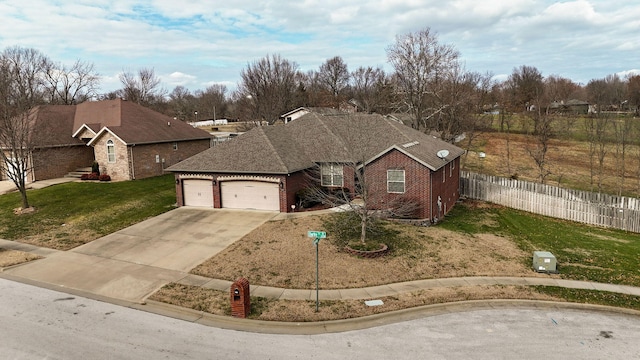 view of front of home with a garage and a front yard