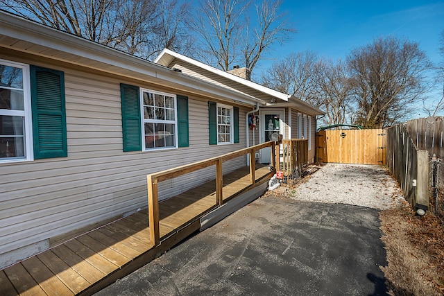 view of property exterior featuring a deck