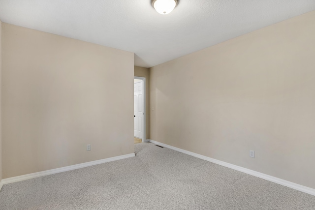 unfurnished room featuring carpet floors