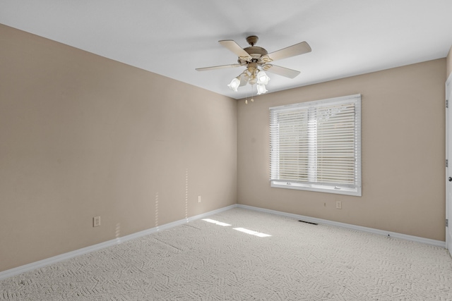 carpeted empty room with ceiling fan