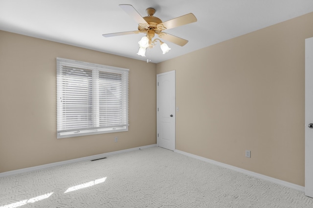 carpeted empty room with ceiling fan