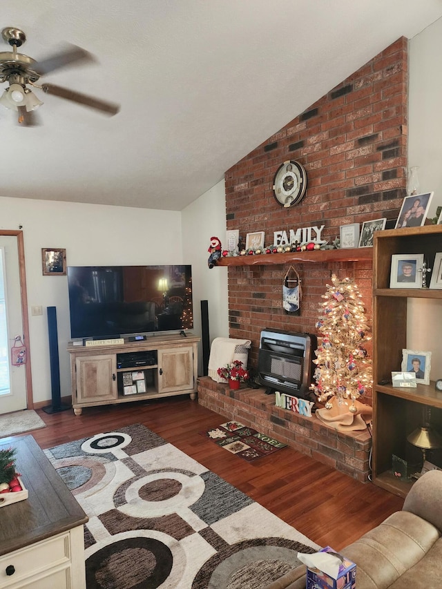 living room featuring ceiling fan, dark wood-type flooring, and vaulted ceiling